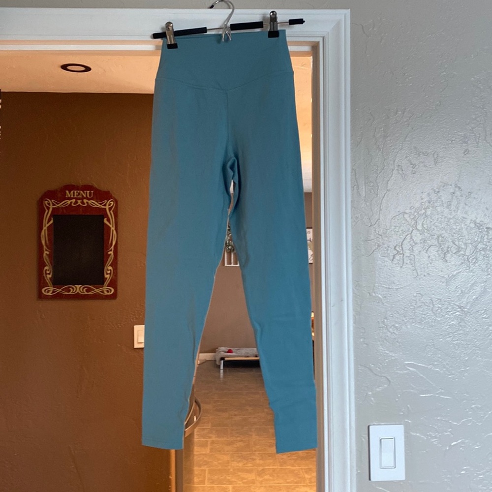 Balance Athletica leggings. Medium leggings, bluish/green, and dark purple.